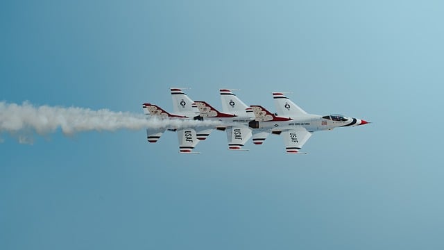 Archivist examining original aircraft blueprints in climate-controlled storage